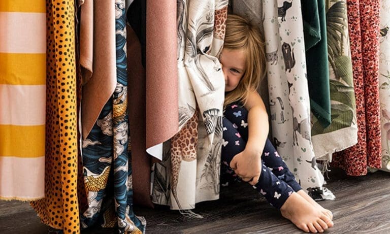 girl between curtains