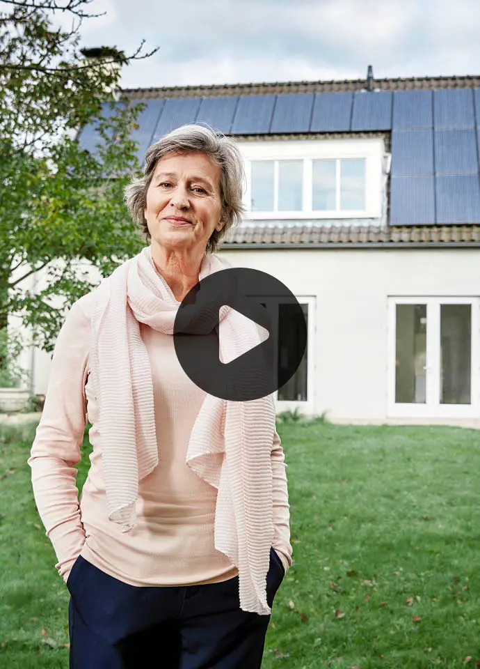 woman in front of house